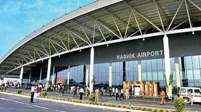 Nashik Airport Cab Booking terminal exterior at night for airport cab pickup and drop service